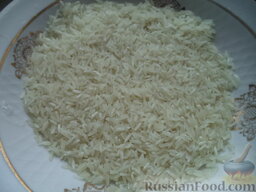 Каша рисовая на молоке: Рис перебрать, хорошо промыть ( последний раз - в горячей кипяченой воде ), дать стечь.