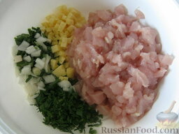 Куриные оладьи с сыром на кефире: Все нарезанные продукты поместить в миску.