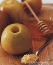 Печеные яблоки, фаршированные имбирем и медом: 6. Каждое яблоко начинить смесью из 1/2 столовой ложки рубленого имбиря и 1 столовой ложки меда.