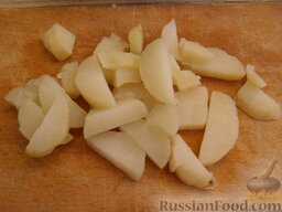 Оливье с шампиньонами и языком: Картофель отварить в мундире (20 минут), очистить и нарезать кубиками.