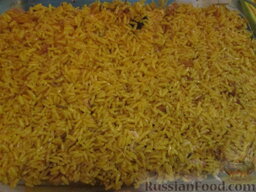 Рисовая запеканка: Закройте слоем риса.